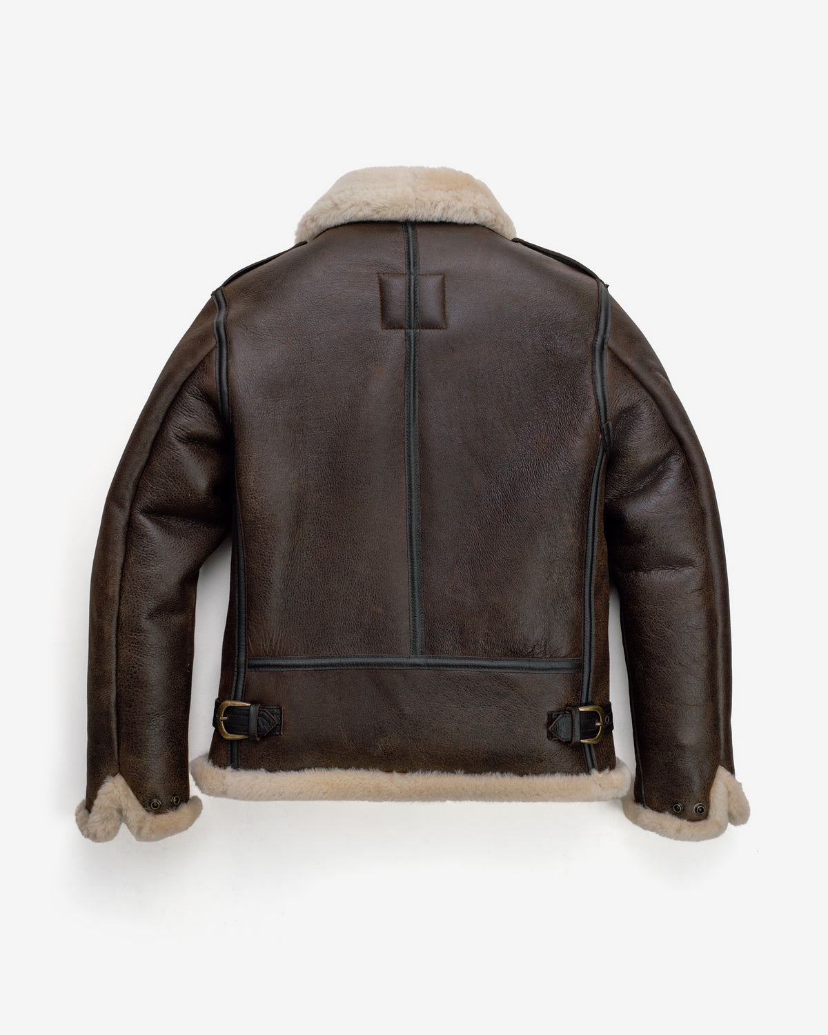 Brown leather jacket with shearling lining on a white background
