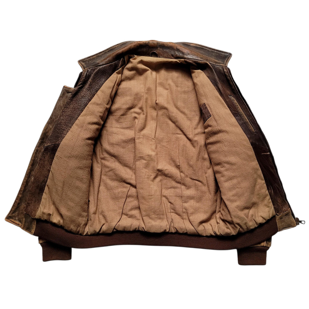 A vintage brown leather jacket shown from the back, featuring a thick tan quilted cotton lining and dark brown ribbed knit trim at the collar, cuffs, and hem.