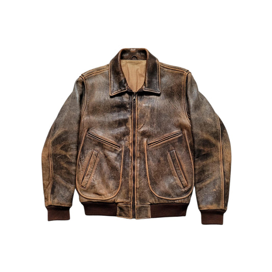 A distressed brown leather jacket with a front zipper, ribbed collar, cuffs, and hem, and two large front patch pockets, shown against a plain white background.