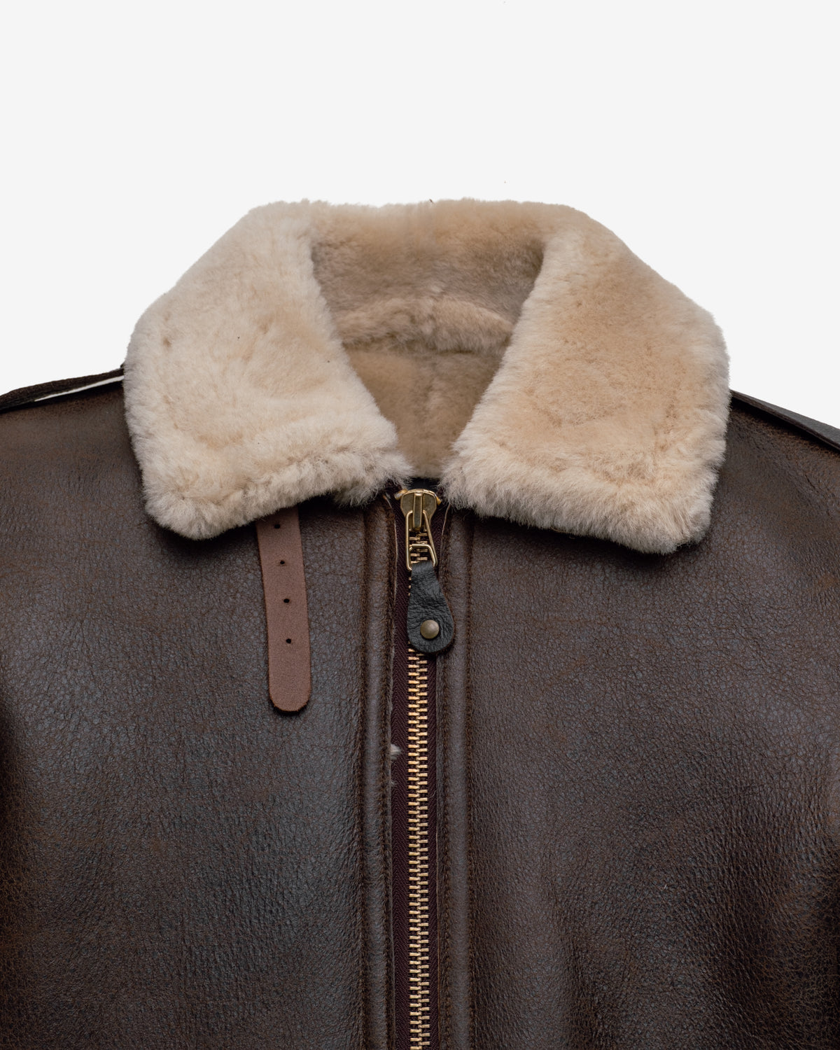 Brown leather jacket with beige shearling collar on a white background