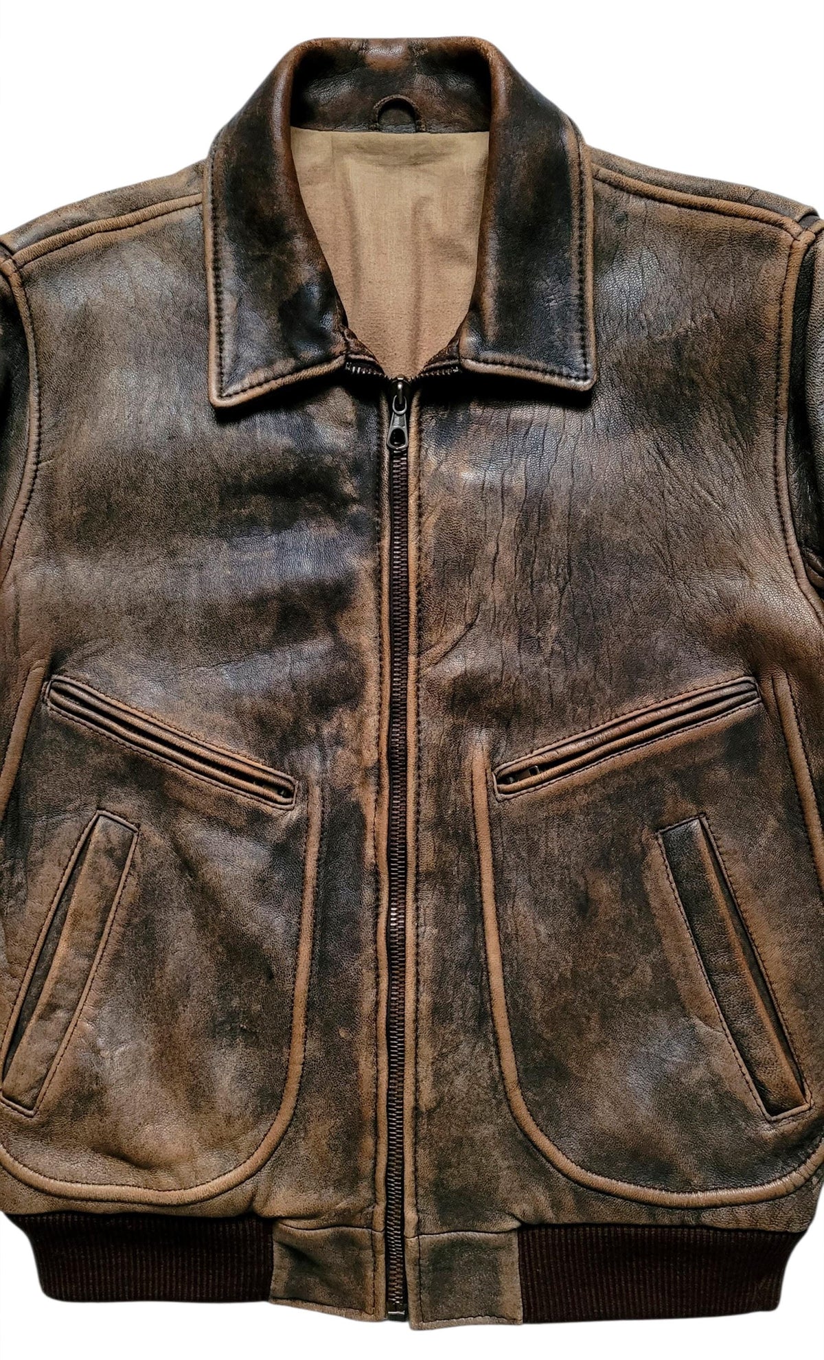A distressed brown leather jacket with a front zipper, ribbed knit collar, cuffs, and hem, and two diagonal zippered chest pockets, shown against a plain white background.