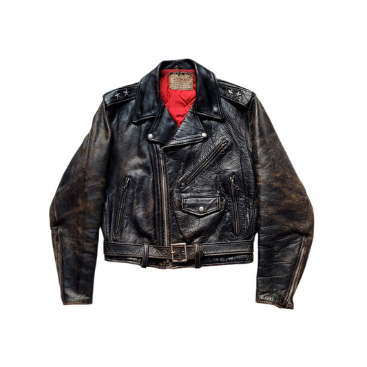 A distressed black leather motorcycle jacket with silver hardware, a red lining visible inside the collar, and a belt, shown against a plain white background.
